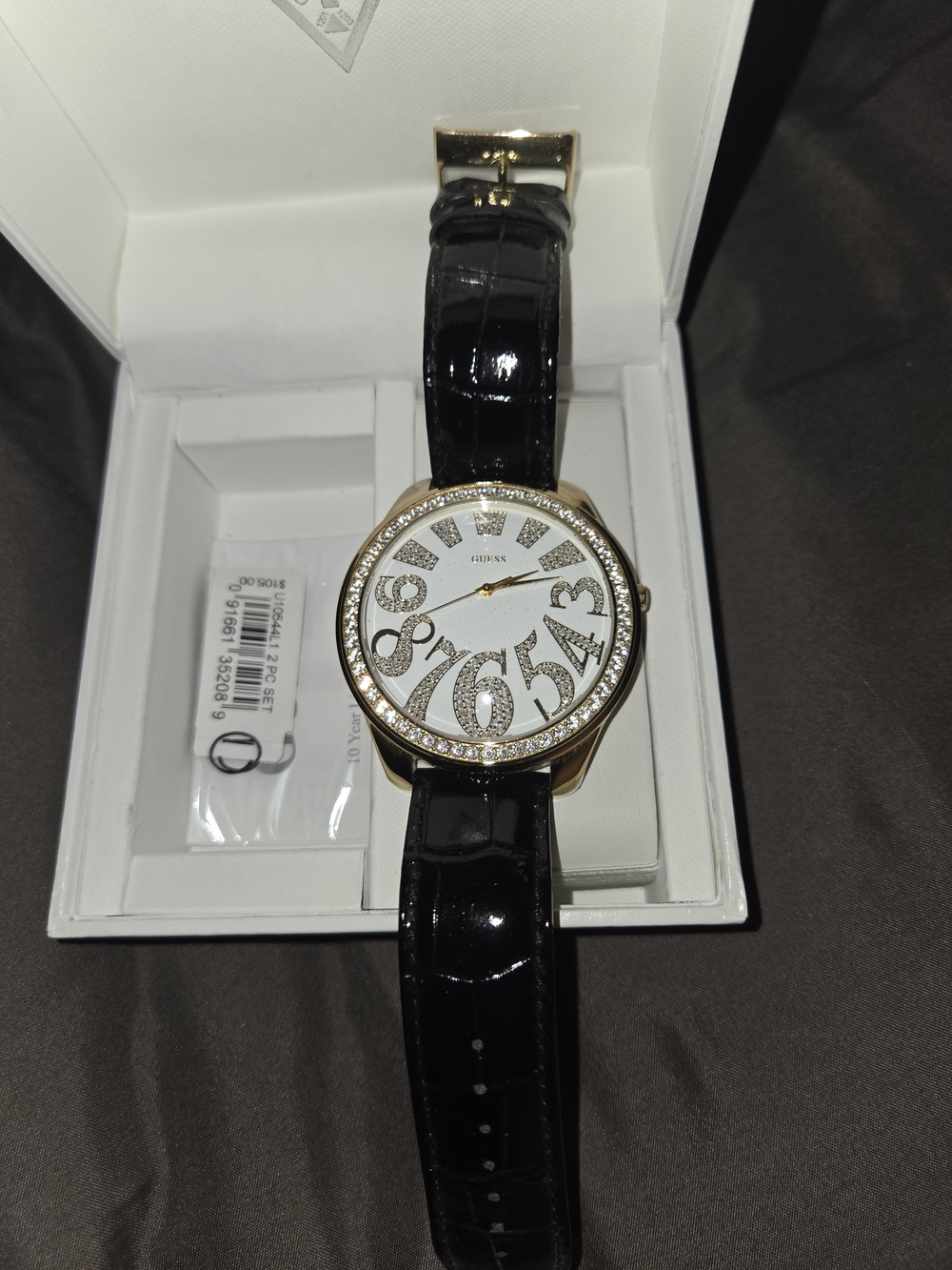 Guess Women's Black Patent Strap Watch with Gold-Tone Crystal Bezel